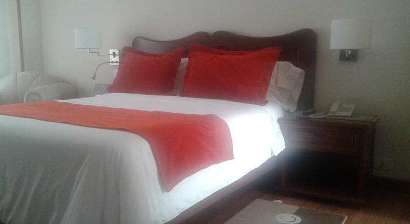 Hotel Santa Lucia Boutique Spa Bogota Bagian luar foto A bed with a duvet cover